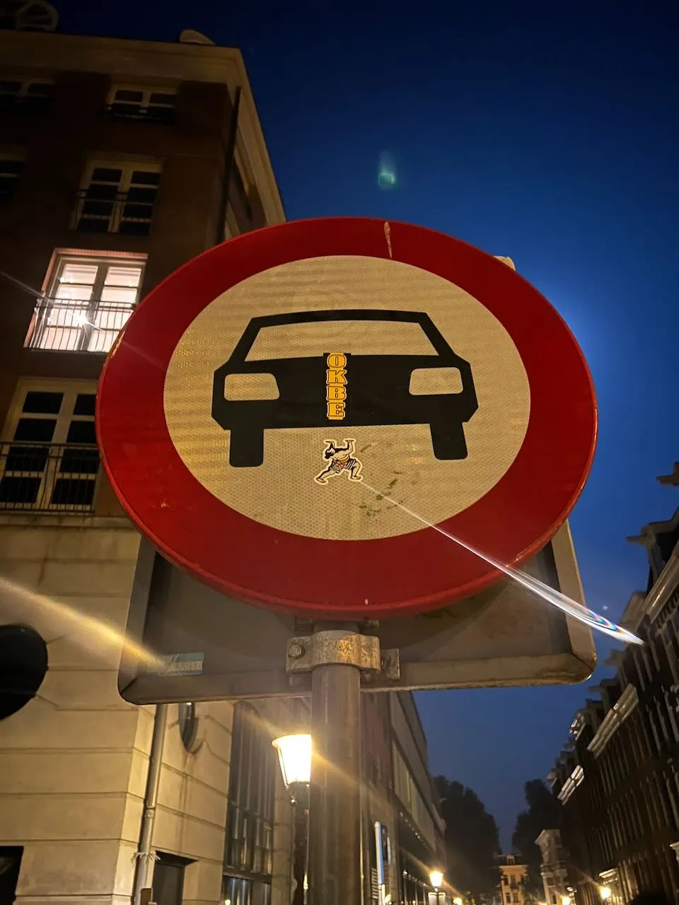 two-handed handstand sumo b-boy sticker on a traffic sign in Amsterdam