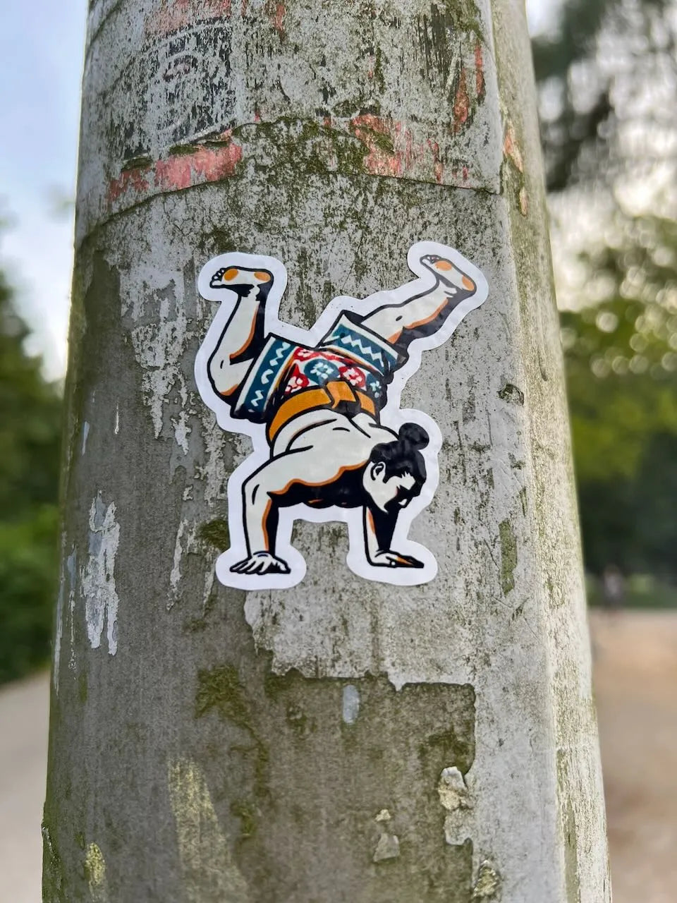 sumo b-boy sticker on a pole in Amsterdam